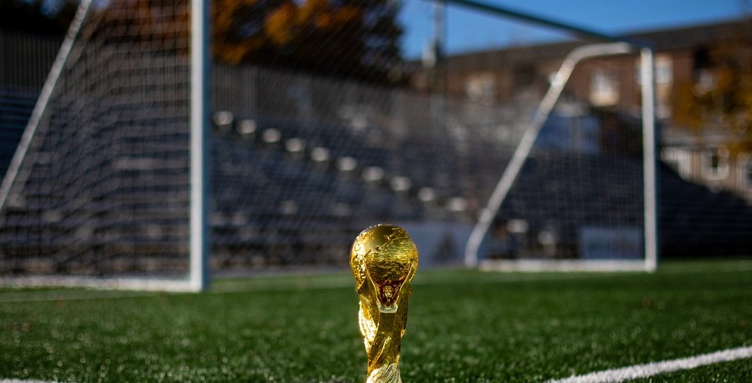 Soccer ball on a green pitch