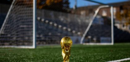 Soccer ball on a green pitch