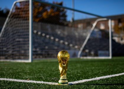 Soccer ball on a green pitch
